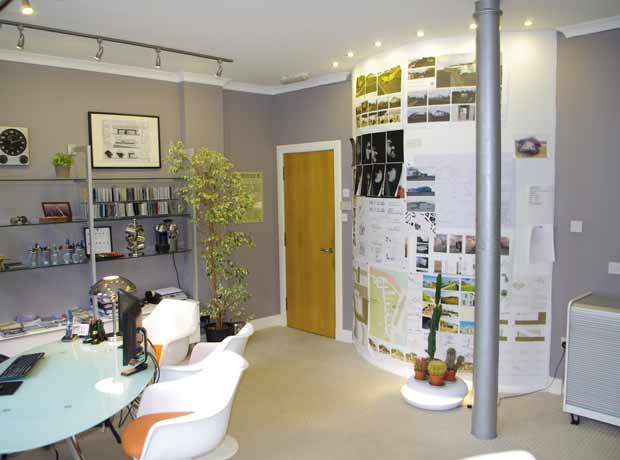 curved wall of studio worknig space and oak door