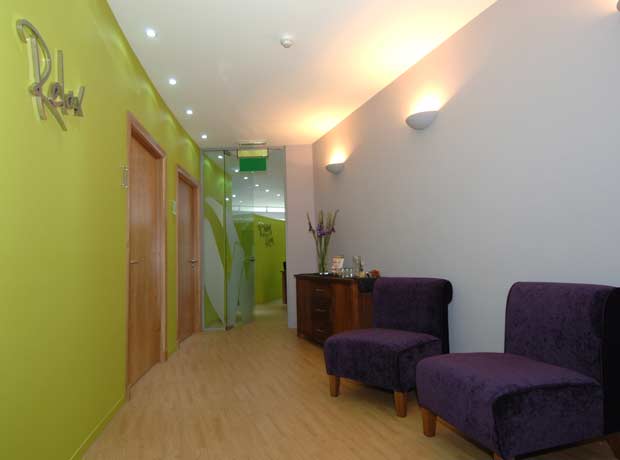 curved wall at entrance corridor with massage rooms