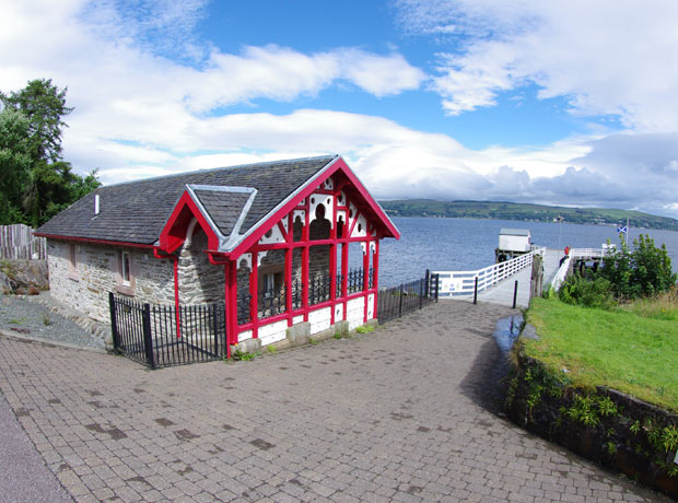 Renewed front gable end of building with view down pier
