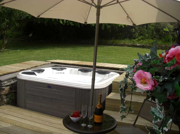 decked hot tub garden area with raised decking