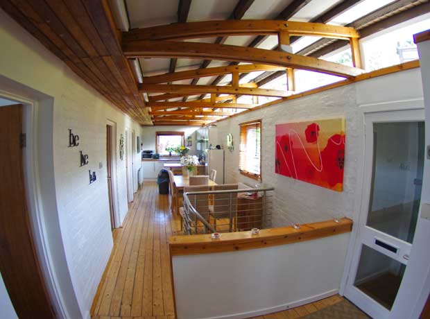 interior open plan living space with beamed ceiling