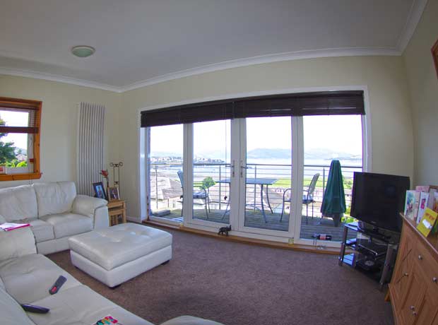 bright living room with view overlooking the River Clyde