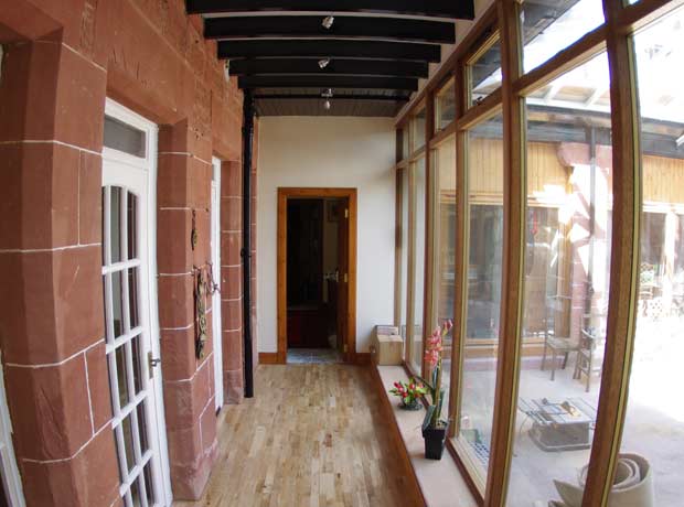 open plan glass corridor to residential dwelling